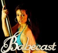 babecast babe in bikini poses next to a pole