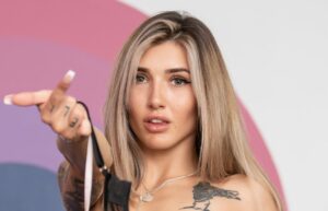 babestation babe kourt thora poses in stockings,and drops her bra