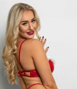 April Mae in christmas red lingerie