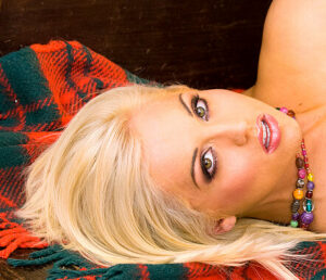 Emily Dean topless in tartan 