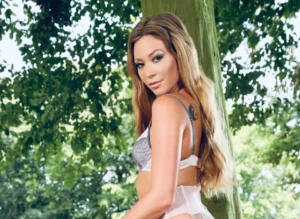 Blonde Natalia Forrest stockings and suspenders