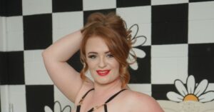 Zara Nevada in black strappy outfit with her tits out