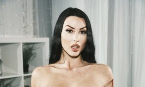Alice Goodwin pulls her bra down