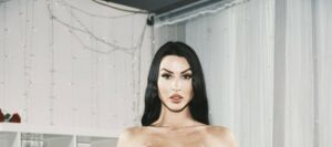 Alice Goodwin covers her tits
