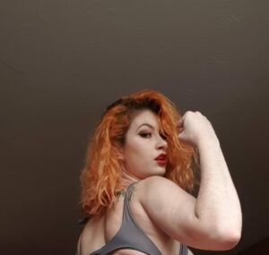 Rosie Gia making a muscle
